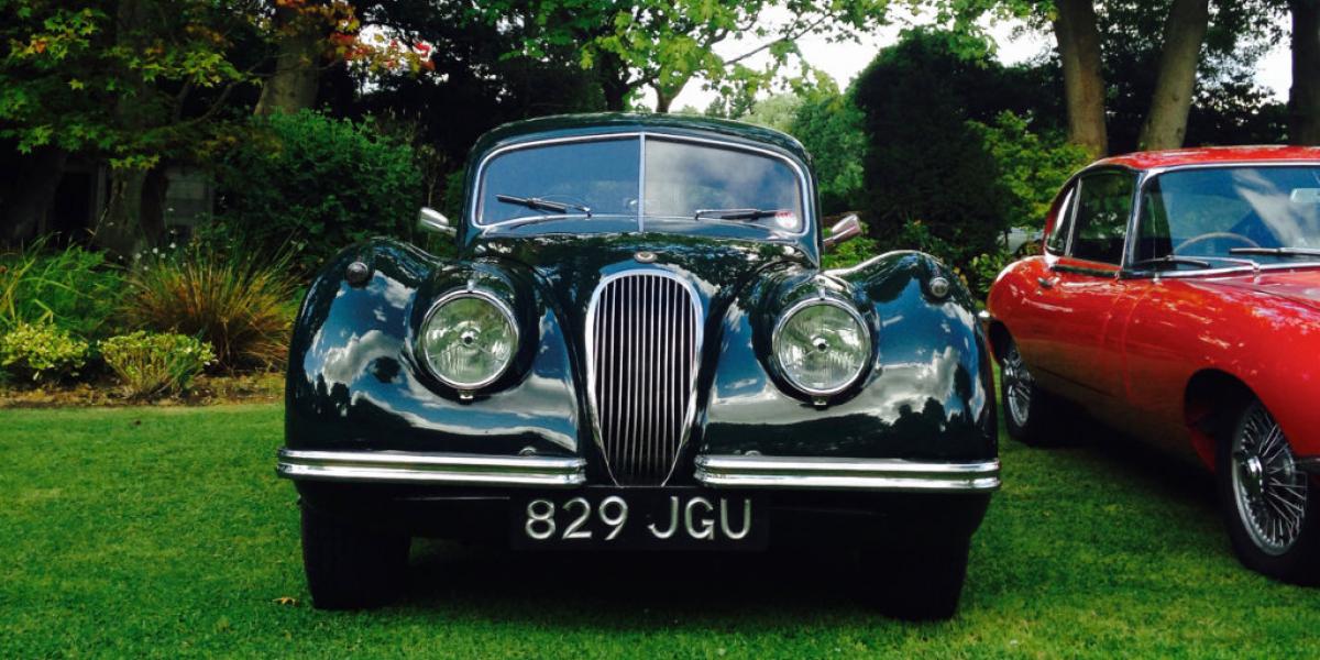 Jaguar XK120 3.4 Litre FHC next to a Jaguar E-Type 4.2 