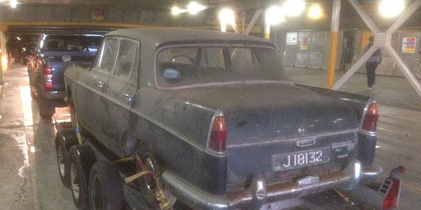 On the ferry from Jersey with a Wolseley 6110 in tow